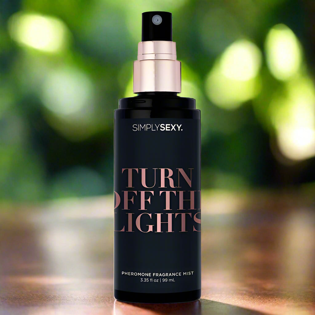 Black bottle of 'Simply Sexy' pheromone fragrance mist on a white background