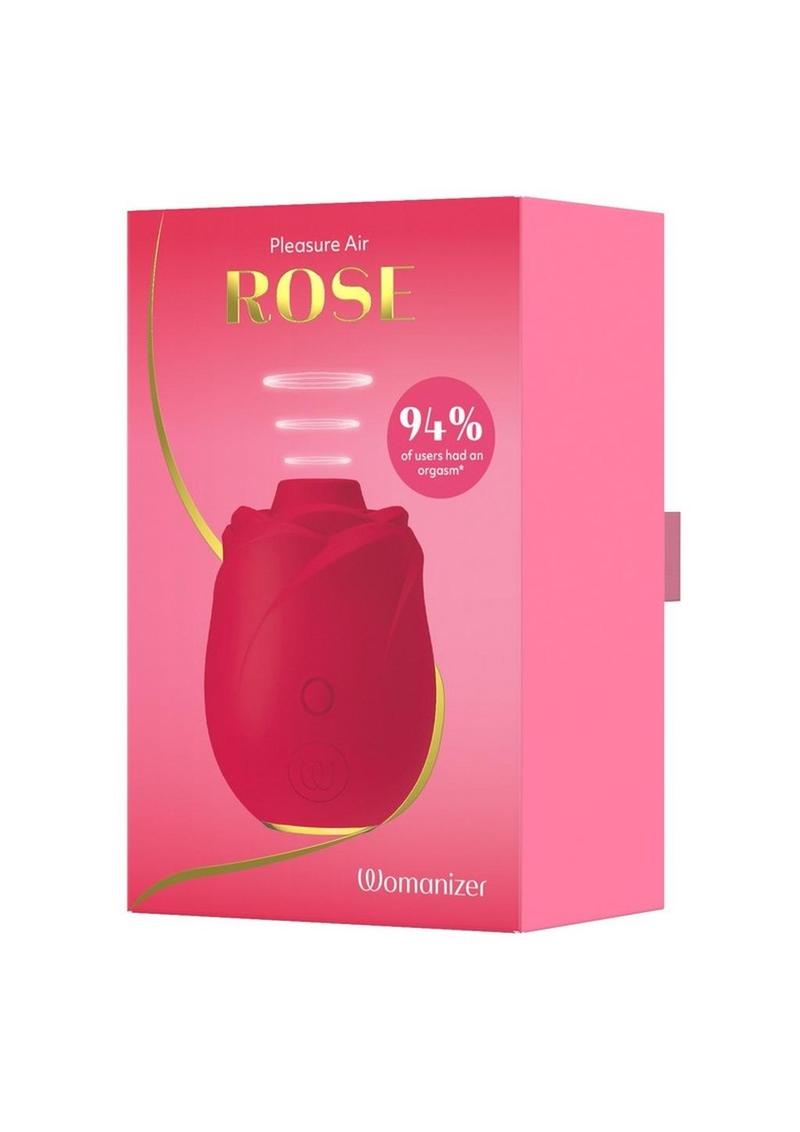 Red rose with 'Womanizer' branding on a pink box against a white background